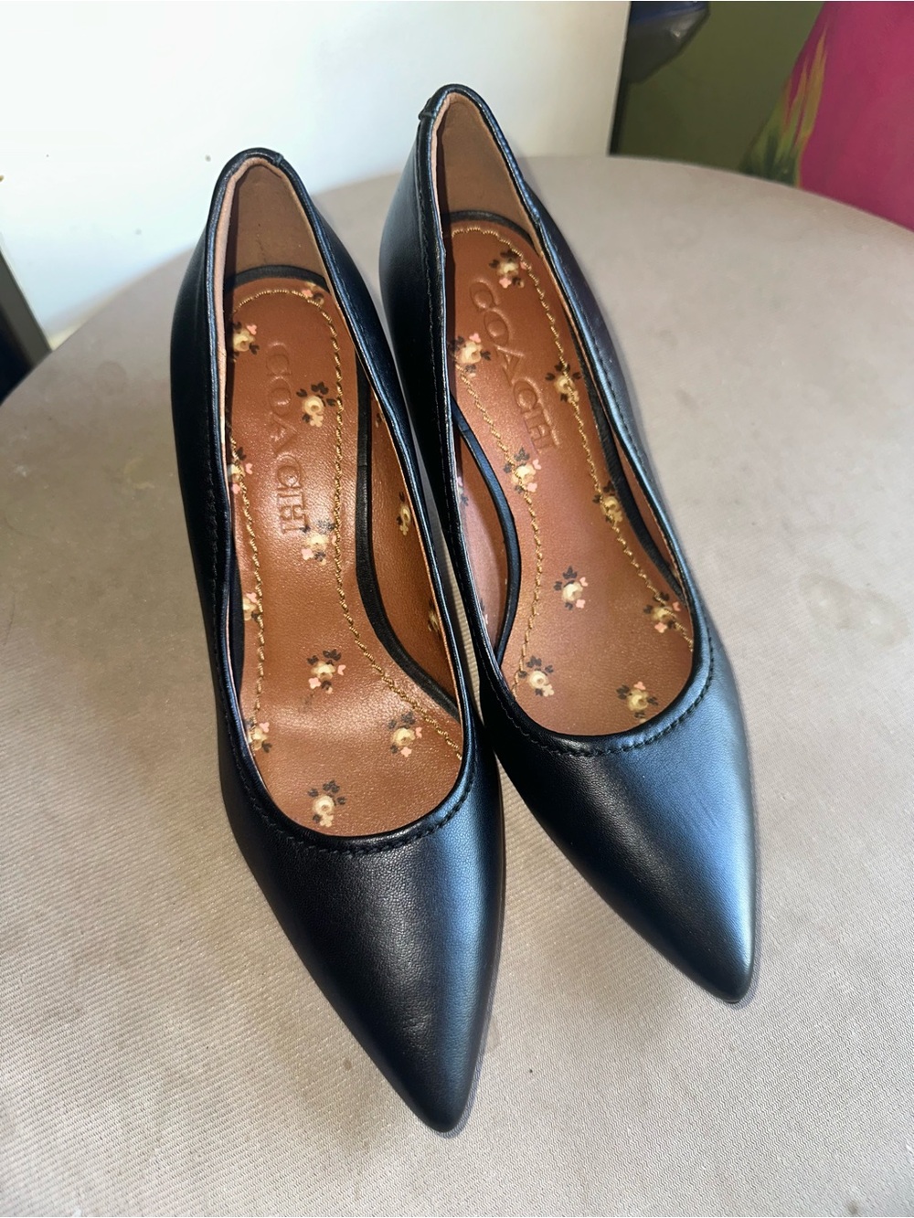 Coach Black Pointed-Toe Leather Pumps with Floral Insole